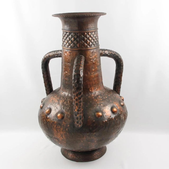 This monumental handmade baluster-form urn vase with handles was made in Italy in the 1960s. The hand-worked details on...