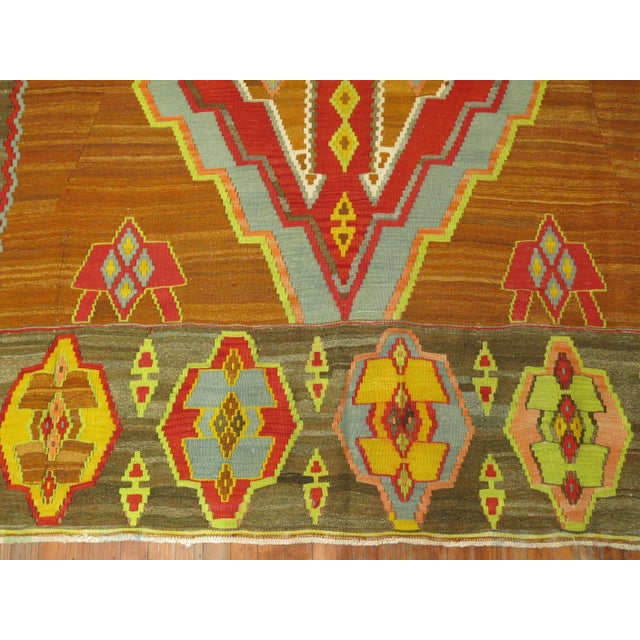 Spectacular one of a kind colorful vintage Turkish Kilim. 3 Large geometric medallions on a brown field surrounded by a...