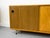 Practical sideboard with two sliding doors and two adjustable shelves inside. High-quality construction with striking...