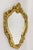 Elegant 18th century gilt wall mirror from the late baroque period around 1790 in Italy. The artfully handcarved, partly...