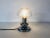 A doria table lamp made in germany in the 1970s. It is fascinating with its rare glass shape. The design of the lamps is...
