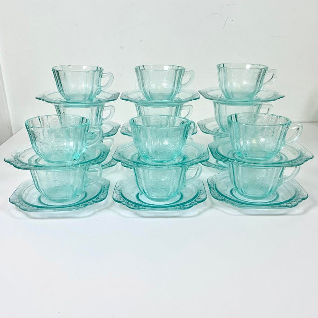 This late Mid-Century set of 30 glass cups and saucers (15 settings) are from the Indiana Glass Company in a beautiful...