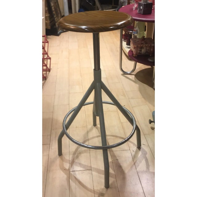 This stool is height adjustable up to 80 cm. This piece has an attribution mark, I am sure that it is completely authentic...