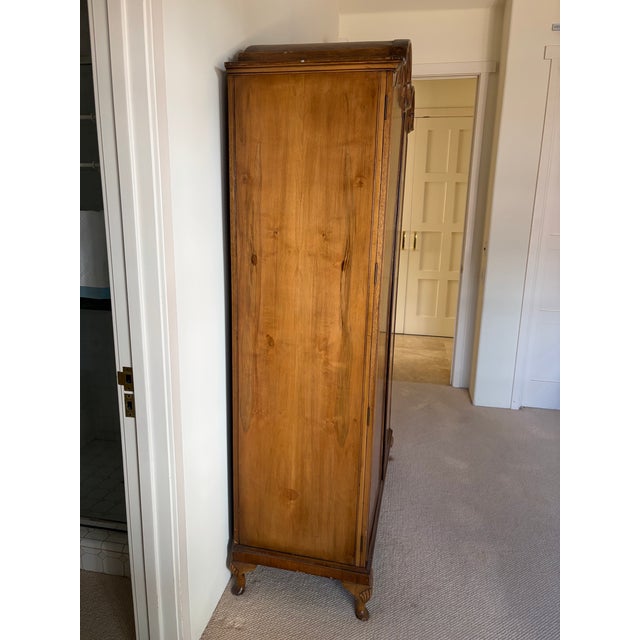 6’-7”H x 4’-0”W x 1’-9”D Beautiful burled walnut armoire.