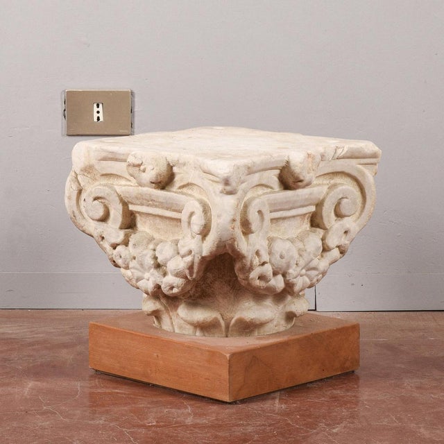 This limestone capital, of a creamy white color with darker veins, has a sculptural workmanship that suggests a classic or...