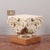 This limestone capital, of a creamy white color with darker veins, has a sculptural workmanship that suggests a classic or...