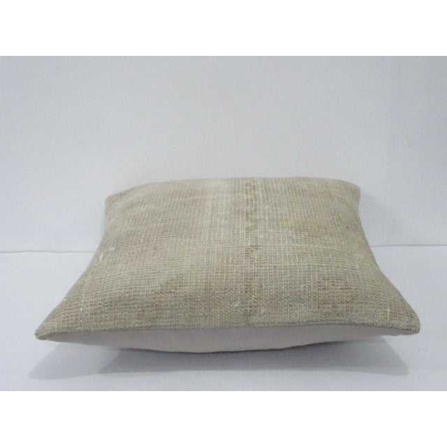 Decorative pillow cover made from a vintage Turkish handknotted rug. Backed with good quality cotton fabric. Pillow...
