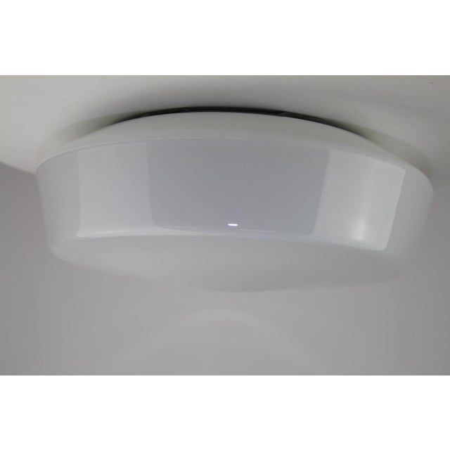 Ceiling or wall lamp made of layered opal glass, metal holder with 1 socket E27, easy removal of the glass by means of a...