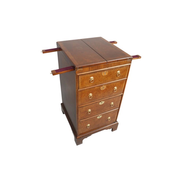A Georgian style bar cabinet made by Baker Furniture for their Historic Charleston collection. The cabinet top folds out...
