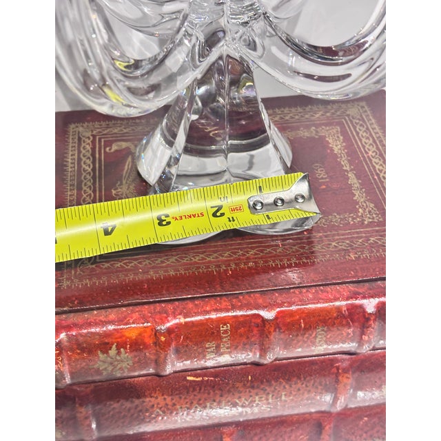 That appears to be a vintage 5-arm crystal candelabra featuring graceful curved arms and a clear faceted base.