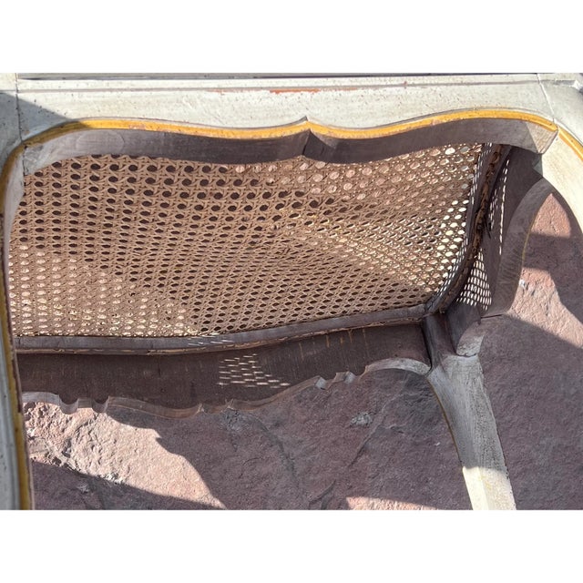 Wonderful Louis XV Style Painted Country French Cane Back Armchair; This elegant Louis XV Country French cane armchair...