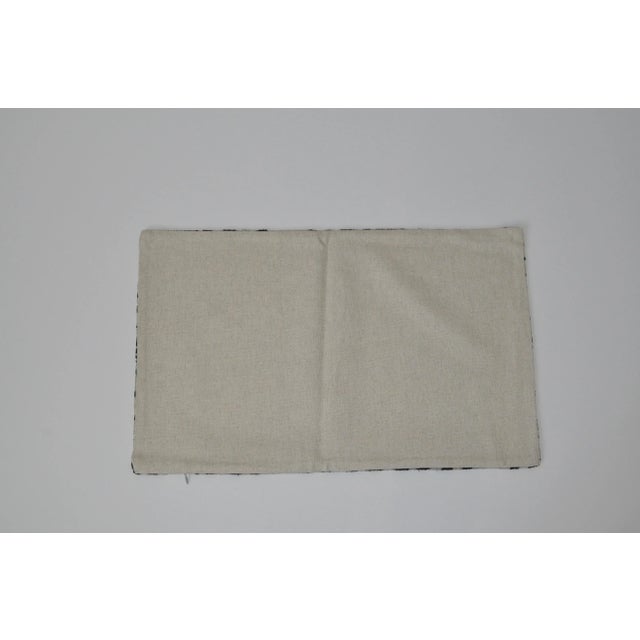 Make a statement with black and white geometric silk velvet accent pillow.. A solid linen for the back side. Pillow has a...