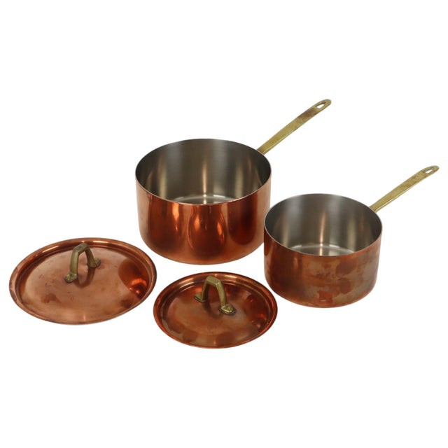Set of 2 copper and brass saucepans manufactured by Paul Revere in the 1960s–70s; high-quality "Limited Edition" pieces,...