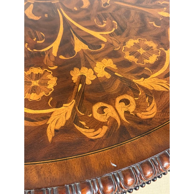 Signature Maitland Smith piece, this tall center table offers incredible marquetry details on the top surface and...