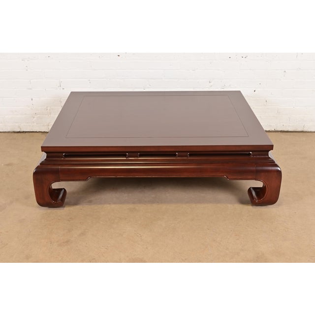An exceptional mid-century modern Hollywood Regency Chinoiserie carved mahogany coffee table or cocktail table By Henredon...