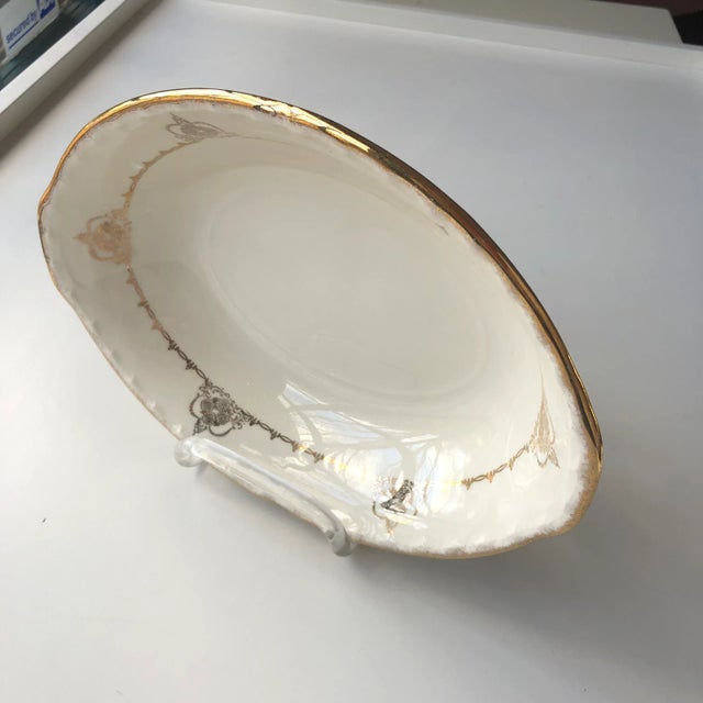 Vintage cream and gold filagree design oval serving bowl 9.75"L X 7"W X 2"H , no makers mark in excellent condition.