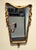 Mid century mirror with unique shape and design. Solid wood with plaster and gold finish. 35" high x 22" wide. Circa 1965.