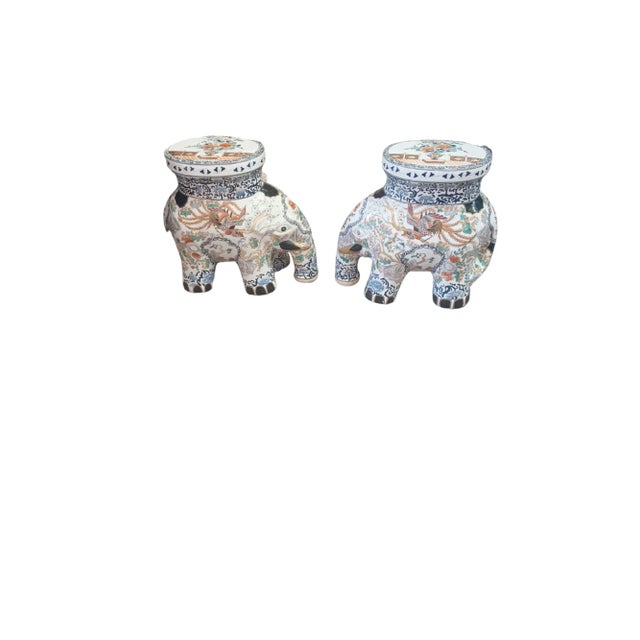 Vintage pair of handpainted Asain elephant plant stands. The pair is dueling with chinoserie decoartions painted on the...