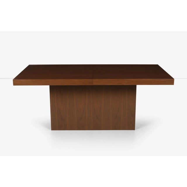 Milo Baughman style dining table, walnut lacquered veneer with pedestal base 71.50" in length with two 18" leaves expands...
