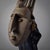 This remarkable mask, characterized by multiple horns and a Chi Wara icon prominently displayed on the forehead, is a...