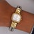 David Yurman-signed quartz watch featuring an 18K yellow gold cushion-shaped case with a diamond bezel, mother of pearl...