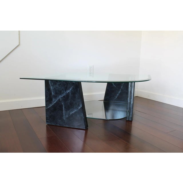 Beautiful Vintage Faux Marble Tiered Coffee Table. The design features two dark Gray/Black faux marble wood bases held...