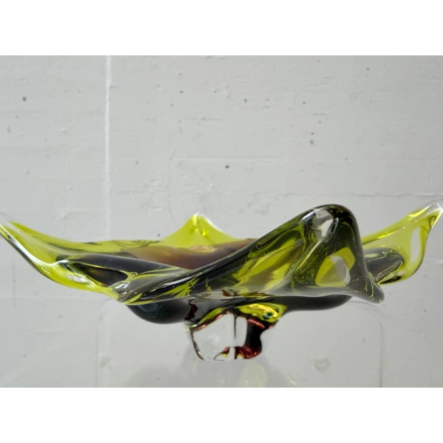 Decorative mouth-blown glass bowl from joska waldglashütte bodenmais with an organically curved silhouette and expressive...