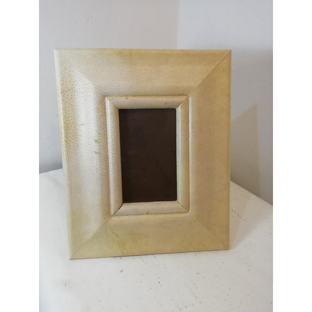 Tabletop photo frame with a wide parchment border. This original vintage piece is designed by Aldo Tura. Photo space...