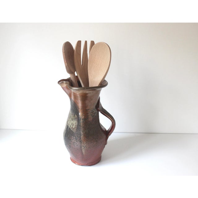 This pitcher is stunning. The colours are hard to describe due to the unique raku process which gives it a slight metallic...