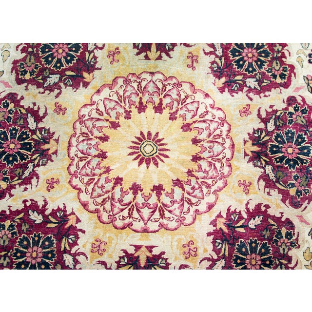 An early 20th century Persian Lavar Kirman rug with the most unique central medallion surrounded by eight individual...