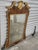 Antique late 19th century George II style mahagony mirror with gilt detailing. The scalloped frame is adorned with rope...