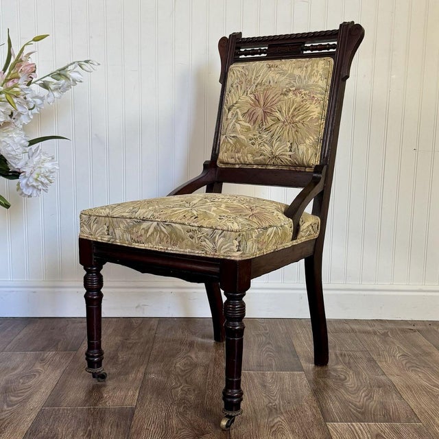 Antique upholstered library/parlor chair from ca. late 1800s–early 1900s. This piece features wonderful old-world...