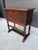 Beautiful vintage wood cabinet featuring an ornate, Old World design with carved detailing, turned legs, decorative...