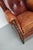 This cognac-colored leather club chair comes from the Netherlands. It is upholstered with cognac-colored leather and...