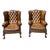 A pair of Edwardian Chippendale-style Leather Wingback Chairs, shaped and slanted, with hand-tied button tufting, trimmed...