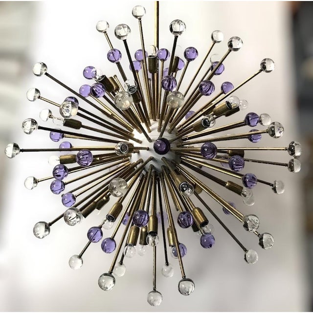 Italian modern Sputnik chandelier with hand blown clear and lilac Murano glass spheres, mounted on natural brass frames...