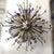 Italian modern Sputnik chandelier with hand blown clear and lilac Murano glass spheres, mounted on natural brass frames...