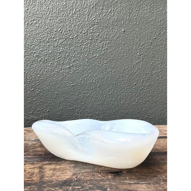 This stunning vintage opalescent art glass bowl epitomizes Mid-Century Modern elegance with its organic, amorphic form....