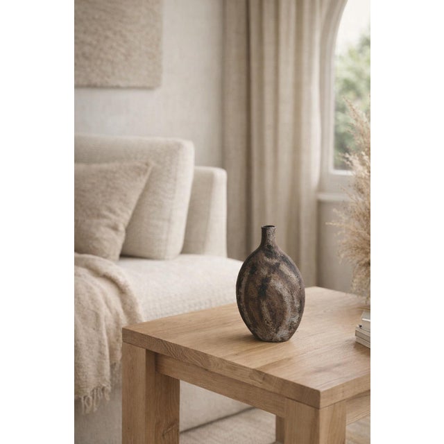 Bring a touch of organic modern artistry to your space with this striking hand‑thrown studio pottery vase, crafted in...