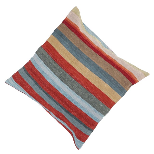 A one-of-a-kind handwoven wool kilim floor pillow featuring a rich horizontal stripe of red, slate-blue and sage. Fully...