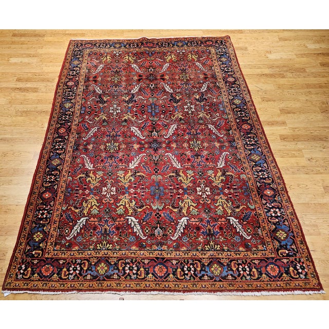 "This outstanding vintage Persian Heriz Serapi rug, woven in the early 1900s in the Azerbaijan region of Northwest Persia,...