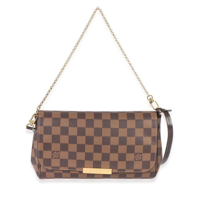 Item #: 154389 Interior Material: Fabric Dimensions: 9.5 x 6 x 1.75 in Features Interior: One slip pocket Strap Length:...