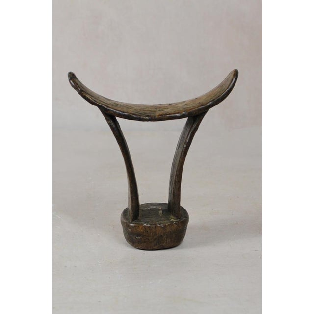 These solid wood Headrests are from groups in southern Ethiopia used to enable people to sleep without interfering with...