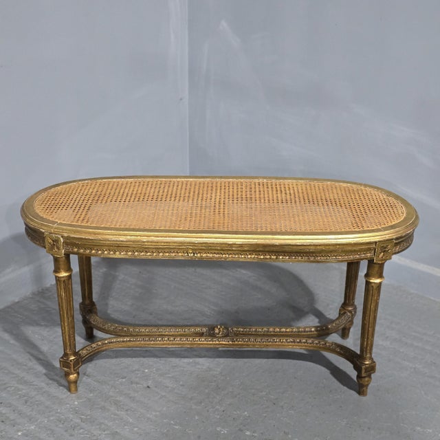Very nice French gilt duet or footboard stool, with bergere cane top and green silk seat pad, in very good overall...