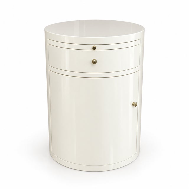 Refined custom cylindrical cabinet table by William Switzer, produced 2018, finished in a high-gloss cream-white lacquer...