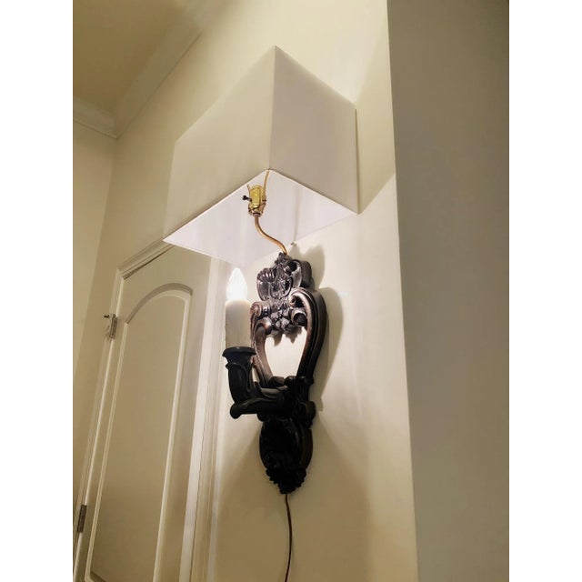 Large Gothic Old World wood wall sconce with double light. Have the two lights on or just one or two. Intricate carving of...