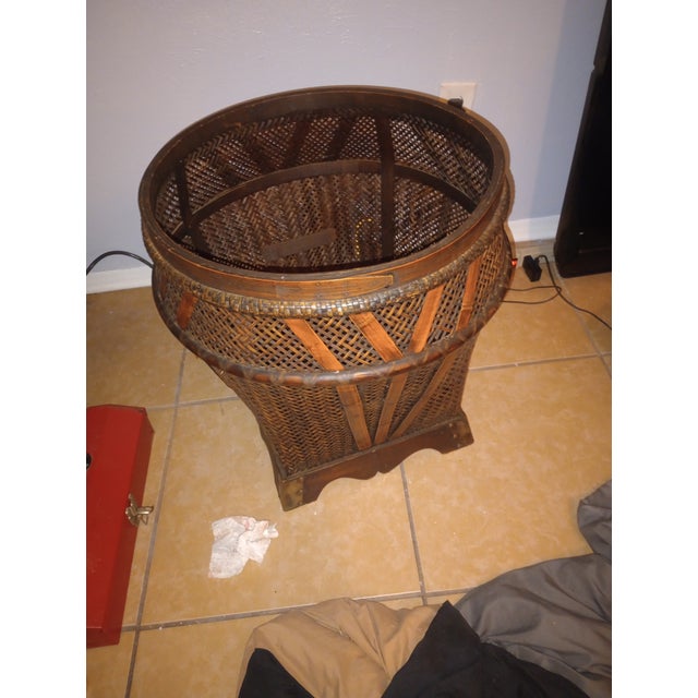 has solid brass hardware, slotted screws, wood base and woven bamboo and sticker that dates its