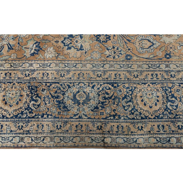 A Late 19th Century Antique Persian Kirman Rug. A symetrical design that is mirrored in both directions. An intricate...