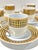 Vintage porcelain espresso set featuring six cups and matching saucers decorated in a bold black-and-gold harlequin...