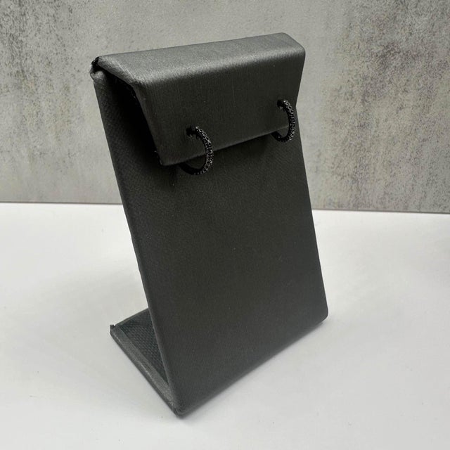 These stylish Black Diamond Huggie Earrings in 14kt gold feature 0.15ctw of round black diamonds, adding a bold sparkle to...